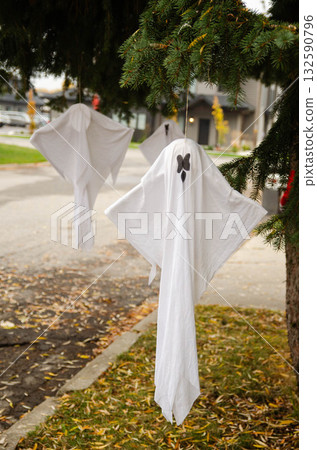 Halloween Ghost Decorations Hanging from Tree Outdoors Halloween Ghost Decorations Hanging from Tree Outdoors 132590796