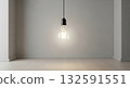 A single glowing light bulb hangs from the ceiling in an empty minimalist room. A single glowing light bulb hangs from the ceiling in an empty minimalist room. 132591551