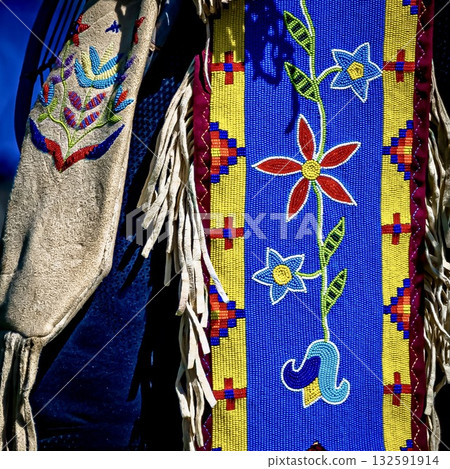 Traditional garment with colorful beadwork and floral designs Traditional garment with colorful beadwork and floral designs 132591914