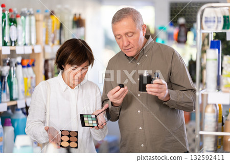 Couple man and woman choosing perfume and cosmetics Couple man and woman choosing perfume and cosmetics 132592411
