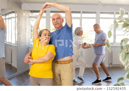 Couple of elderly man and woman dancing waltz Couple of elderly man and woman dancing waltz 132592435