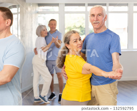 Couple of elderly man and woman dancing waltz 132592795
