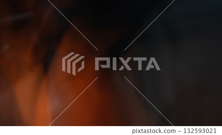 Grainy dark orange and black blur background Grainy dark orange and black blur background 132593021