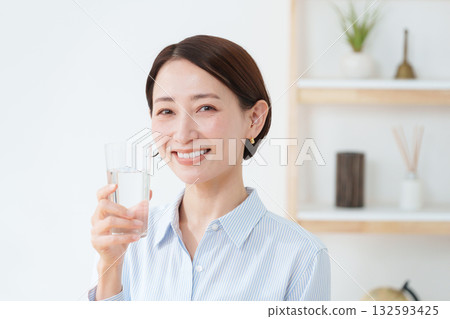 A woman drinking water A woman drinking water 132593425