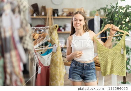 teenager chooses tops for the summer 132594055