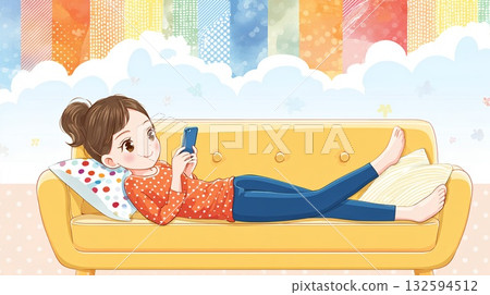 A woman lying on the sofa and using a smartphone 132594512