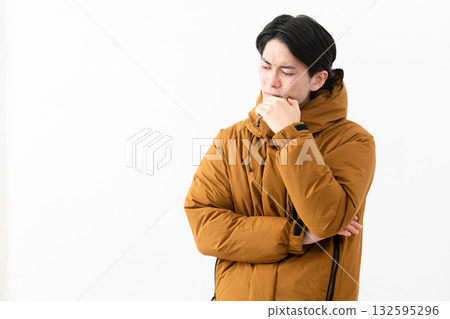 Young man wearing a down coat Young man wearing a down coat 132595296