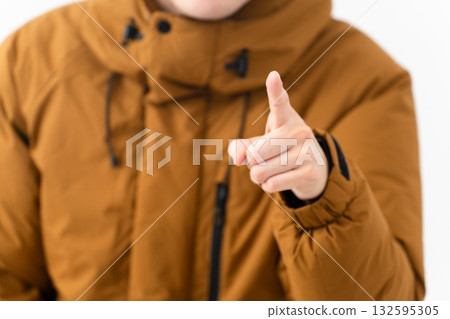 Young man wearing a down coat 132595305