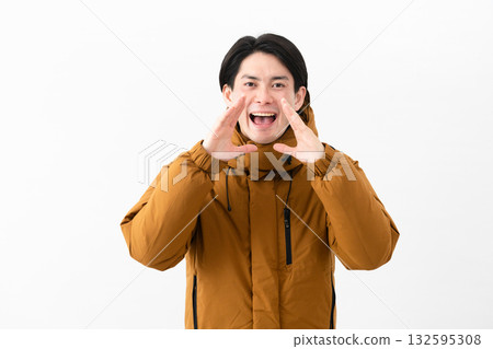 Young man wearing a down coat Young man wearing a down coat 132595308