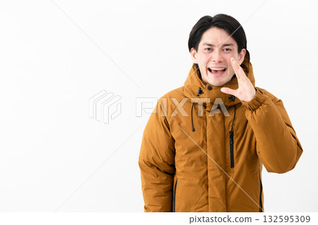 Young man wearing a down coat Young man wearing a down coat 132595309