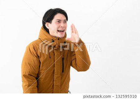 Young man wearing a down coat Young man wearing a down coat 132595310