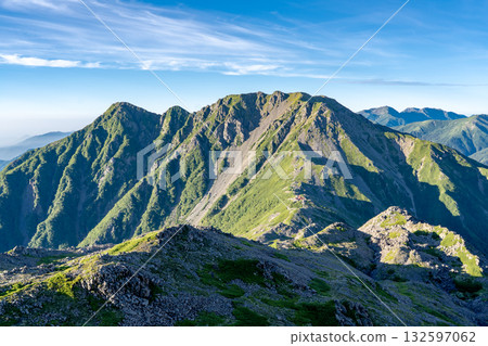 View of Mt. Notori and Mt. Nishi-Notori from Mt. Ainotake. Climbing Mt. Ainotake and Mt. Notori of the Shiramine Sanzan mountains in the Southern Alps. 132597062