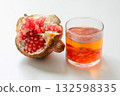 Pomegranate in liquor on a white background 132598335