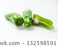 Half-sliced green pepper on white background 132598591