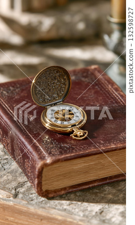 Vintage Pocket Watch on Old Leather Book 132598727