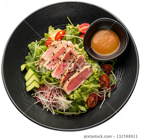 salad with avocado, tomato, onion, olives and sauce 132598911