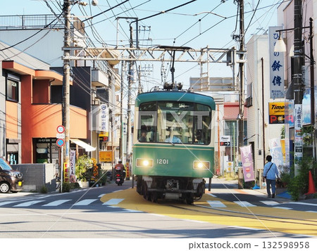 Kanagawa Prefecture, Enoshima Electric Railway running on the roads of Koshigoe, October Kanagawa Prefecture, Enoshima Electric Railway running on the roads of Koshigoe, October 132598958