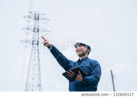 Young employees of a power transmission construction company Young employees of a power transmission construction company 132600127