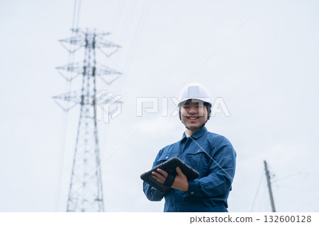 Young employees of a power transmission construction company Young employees of a power transmission construction company 132600128