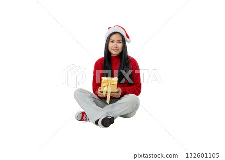 Woman in festive attire sits with a gift, isolated, PNG 132601105