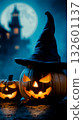 A couple of pumpkins sitting next to each other in front of a full moon 132601137