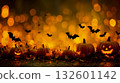 A group of pumpkins and bats flying over a field of leaves 132601142