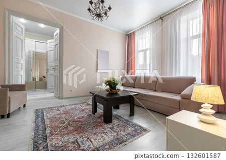 Spacious Bright Living Room with Elegant Decor and Soft Lighting 132601587