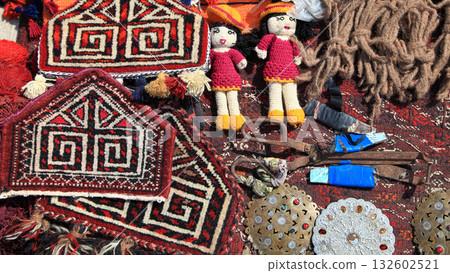 National amulets, old carpet-making tools and vintage silver jewelry.   Turkmenistan. Ashkhabad market. 132602521