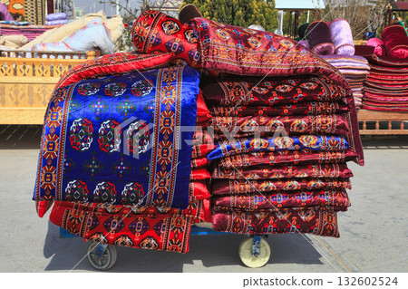 Turkmenistan. Ashkhabad market. National Turkmen mattresses and handmade pillows 132602524