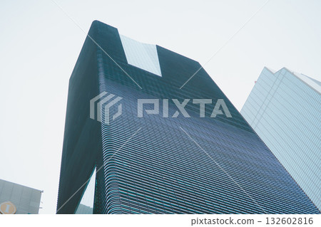 low and wide angle view with high mirror building with sky low and wide angle view with high mirror building with sky 132602816