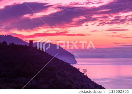 Seascape during sunset. Beautiful sunset over the sea and mountains. Almeria, Malaga, Nerja, Spain 132602895