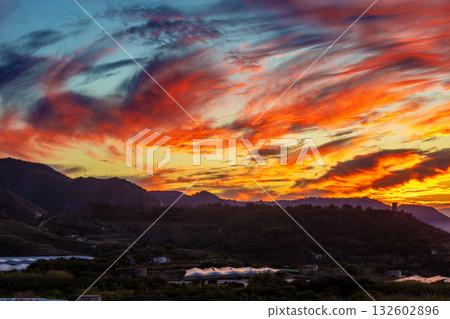 Seascape during sunset. Beautiful sunset over the mountains. Almeria, Malaga, Nerja, Spain 132602896