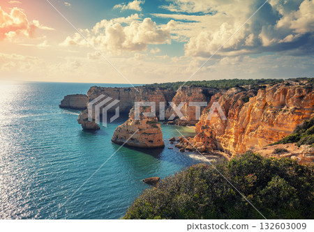 Coastal rocky seascape. View of Praia da Marinha beach in the Algarve region. Atlantic ocean. Portugal, Europe 132603009