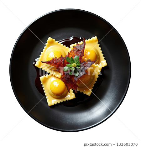 Appetizing gourmet duck confit ravioli pasta dish with sage. An elegant appetizer served black plate for fine dining 132603070