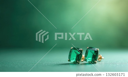 Elegant pair of emerald stud earring precious jewel on green background. luxurious aesthetic shines brightly 132603171