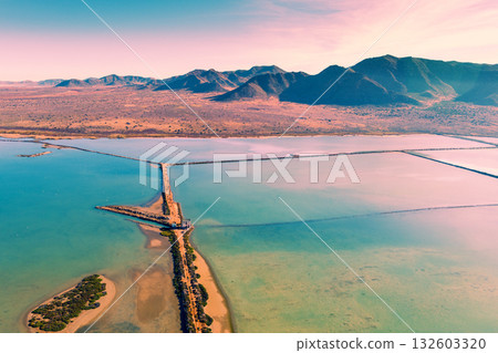 Salt lake in the Cabo de Gata nature reserve at sunset. Salt flats of Cabo de Gata. Drone view. Almeria Spain Salt lake in the Cabo de Gata nature reserve at sunset. Salt flats of Cabo de Gata. Drone view. Almeria Spain 132603320