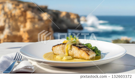 Delicious grilled barramundi fish with lemon myrtle butter and broccolini. fresh food meal with scenic ocean view Delicious grilled barramundi fish with lemon myrtle butter and broccolini. fresh food meal with scenic ocean view 132603372