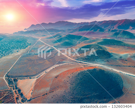 Aerial view of Rocky seashore with Dramatic sunset sky. Seascape in the evening. Cabo de Gata-Ntjar reserve. Almeria Andalusia Spain 132603404