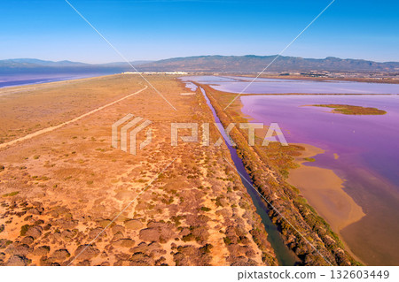 Salt lake in the Cabo de Gata nature reserve at sunset. Salt flats of Cabo de Gata. Drone view. Almeria Spain 132603449