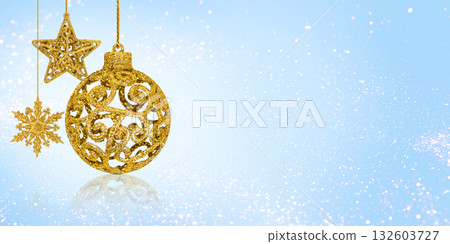Christmas blue background with Christmas tree decorations with a golden snowflake, star and ball and golden lights with copy space. New Year and Christmas card. Banner Christmas blue background with Christmas tree decorations with a golden snowflake, star and ball and golden lights with copy space. New Year and Christmas card. Banner 132603727