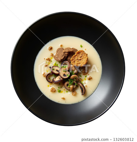 Gourmet mushroom soup, creamy veloute with truffle and chive in dark bowl for comforting and elegant meal 132603812