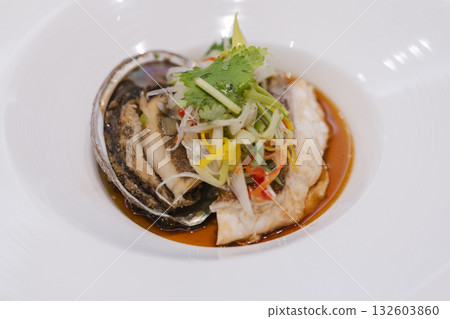 Abalone and white fish sauteed with herbs Chinese course meal Abalone and white fish sauteed with herbs Chinese course meal 132603860
