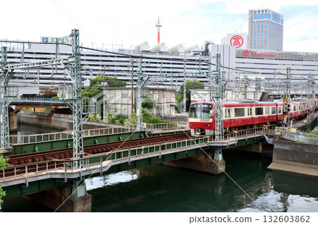 Keihin Kyuko Line crossing the railway bridge over the Katabira River in Yokohama 132603862