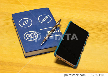 Book, smartphone and pen Book, smartphone and pen 132604400