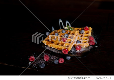 Belgian Liege waffles with berries, blueberrie Sweet breakfast dessert 132604695