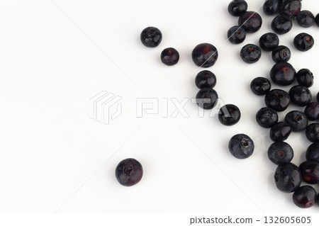 Blueberries scattered on a white background. 132605605