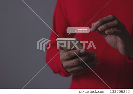 Customer Review, Young Man hand holding Smart Phone with five star to review and give 5 stars  132606233