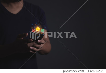 Young Man hand holding Smart Phone with five star to review and give 5 stars 132606235