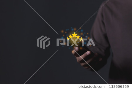 Customer Review, Young Man hand holding Smart Phone with five star to review and give 5 stars Customer Review, Young Man hand holding Smart Phone with five star to review and give 5 stars 132606369