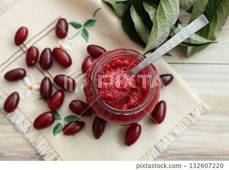 Homemade preserved jam from Cornelian cherry dogwood, lat. Cornus mas macrocarpa, in a jar. Homemade preserved jam from Cornelian cherry dogwood, lat. Cornus mas macrocarpa, in a jar. 132607220